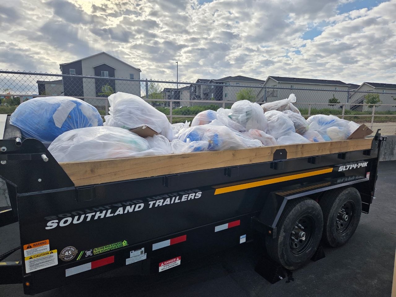 Trailer loaded with bagged debris from a property cleanout