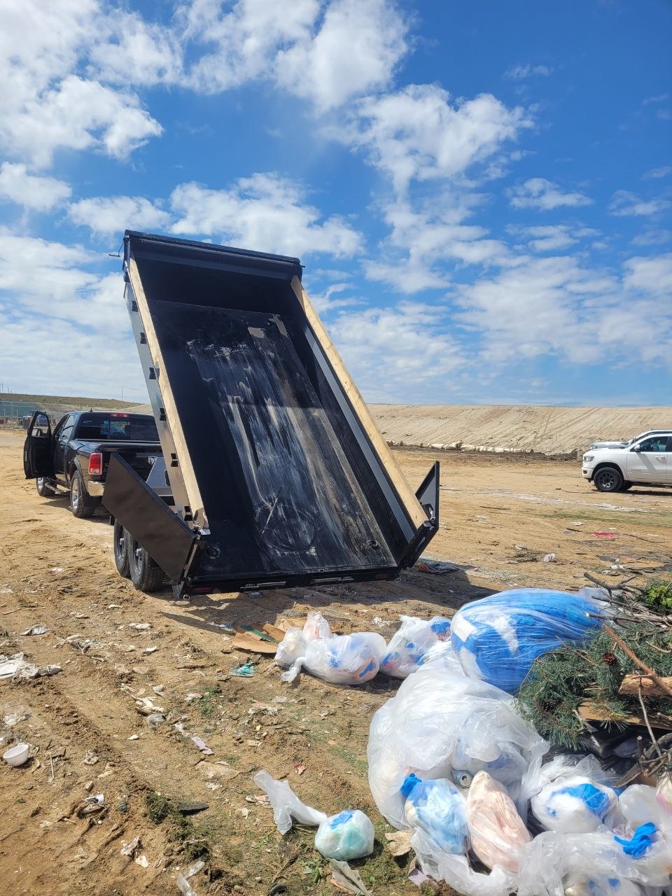 Empty dump trailer tipped up after unloading a job