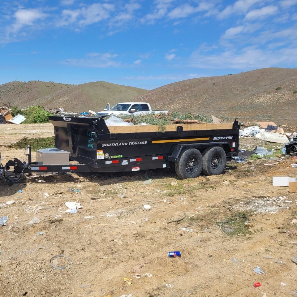 Trailer at the landfill dropping off a mixed debris load